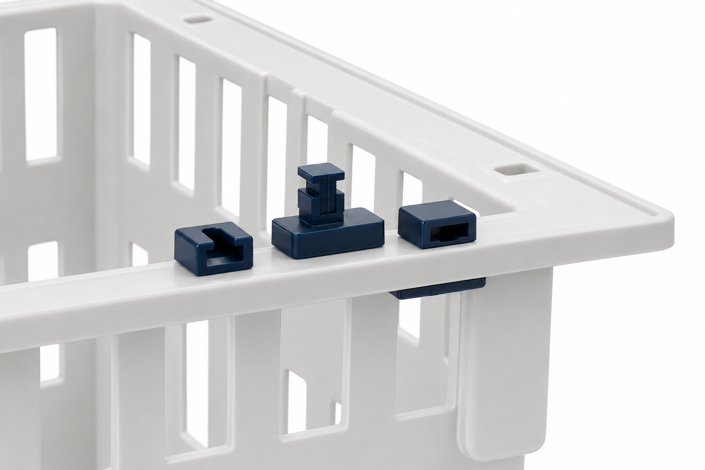 Three dark blue plastic locking clips shown on the rim of a white plastic storage crate against a white background.