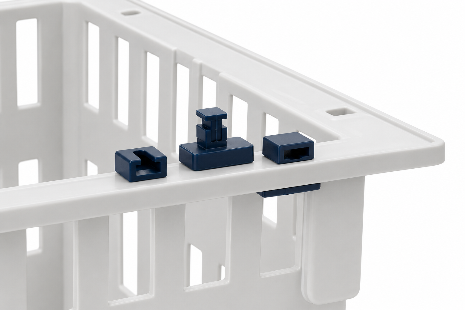 Three dark blue plastic locking clips shown on the rim of a white plastic storage crate against a white background.