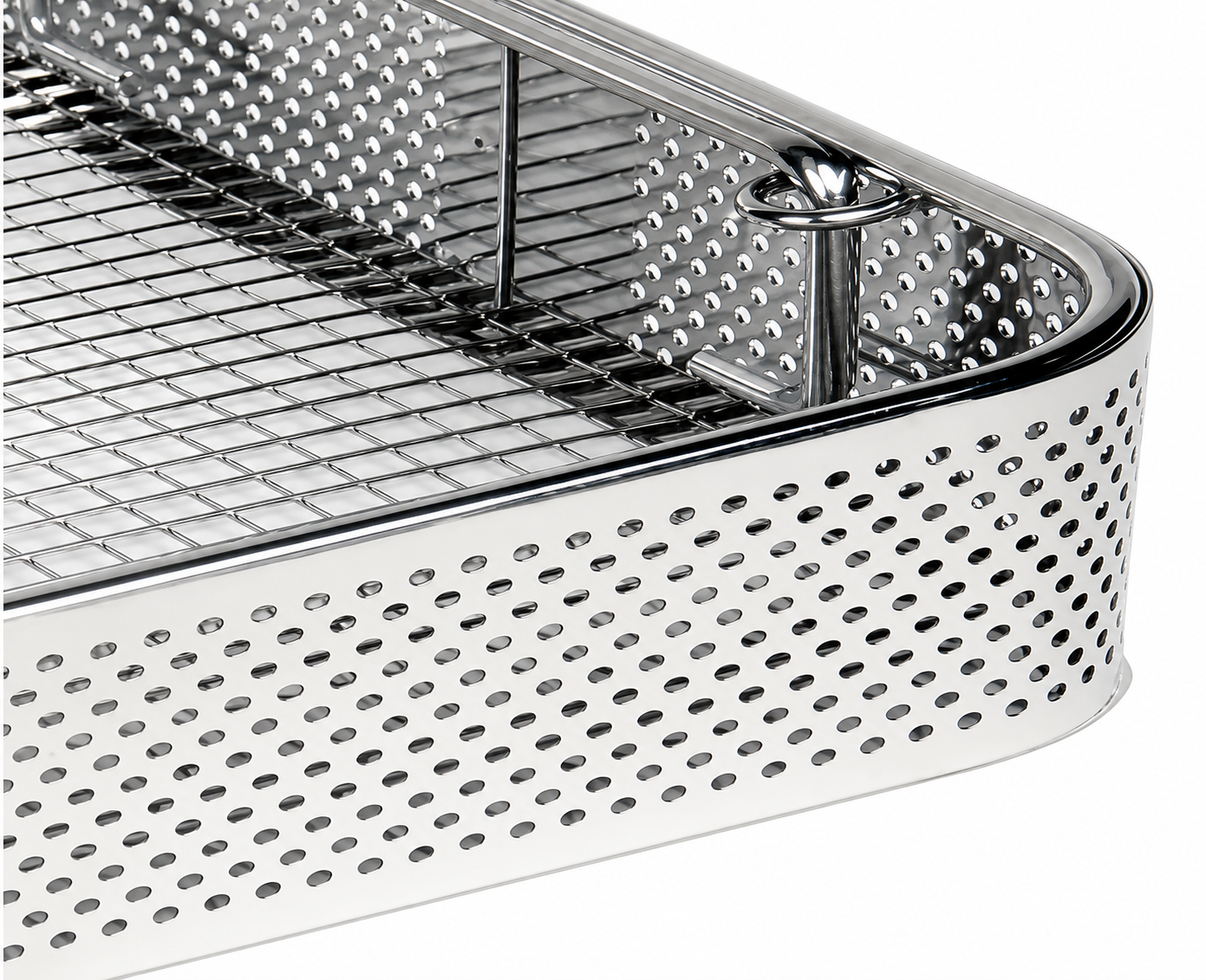 Metal instrument tray with perforated design on a white background