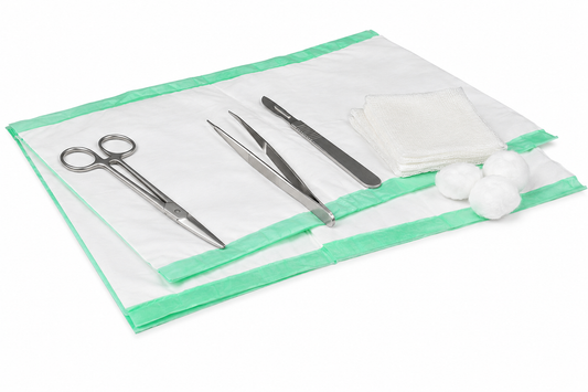 Set of surgical instruments on a green and white tray with cotton balls.