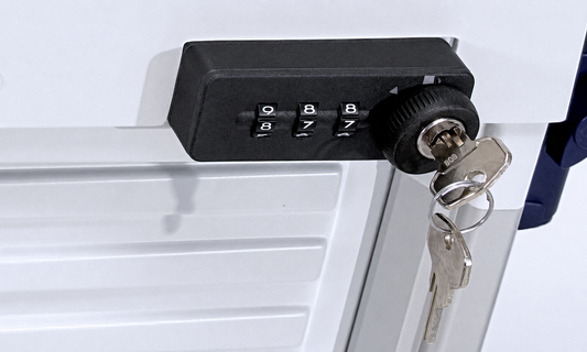 A black 3-digit combination lock with two keys inserted, mounted on a white metal cabinet door.