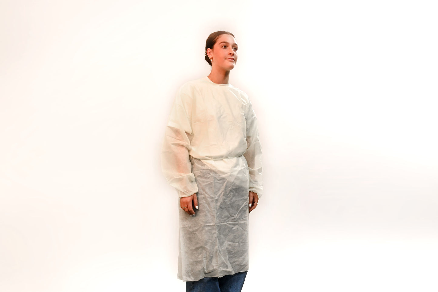 Person wearing a isolation gown on a white background